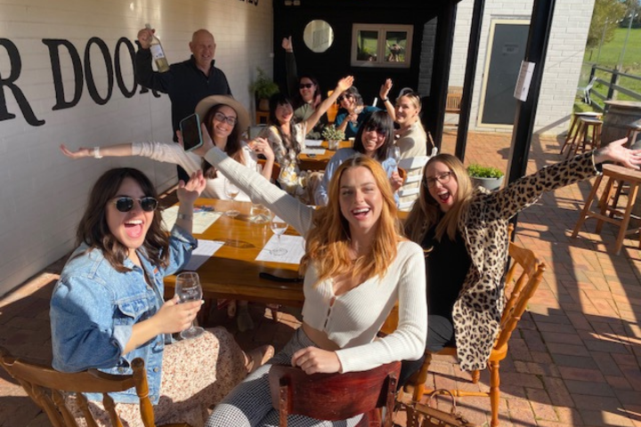 a group of people sitting posing for the camera
