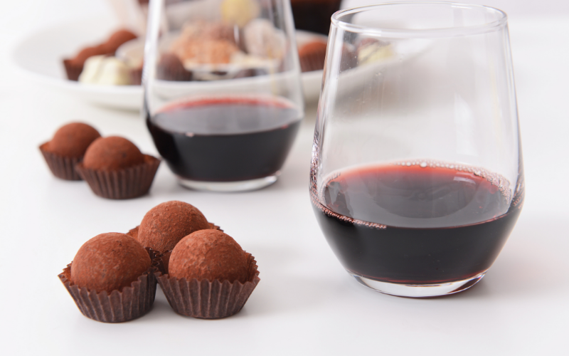 wine and chocolate a close up of a wine glass on a table