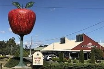 a house that has a sign on the side of a building