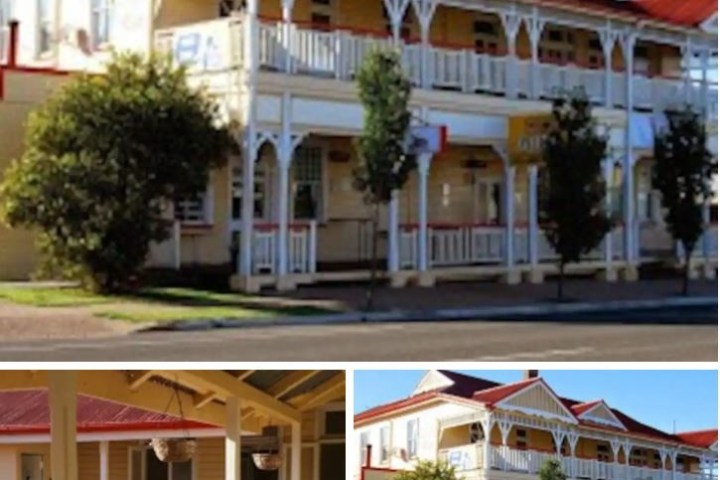 a group of people in front of a house