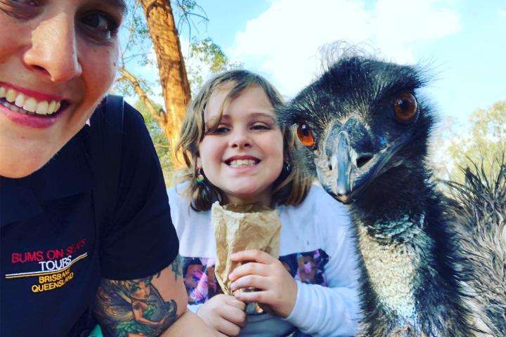 a woman holding an animal