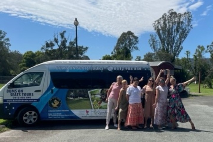 a group of people standing in a parking lot